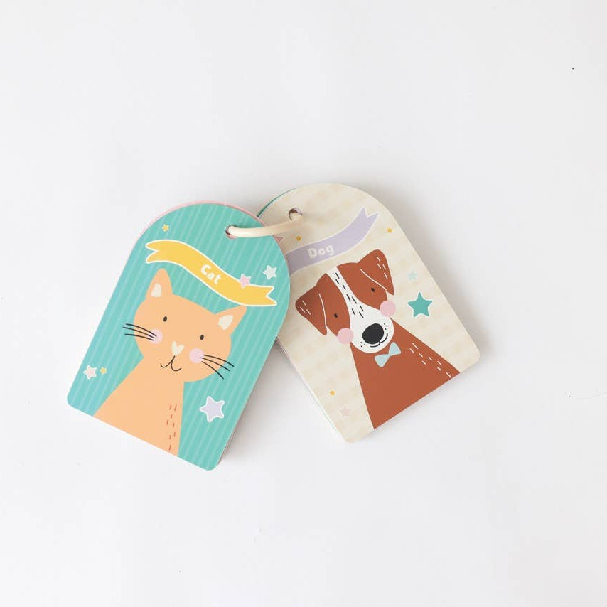 Two colorful key tags with cat and dog illustrations on a white background